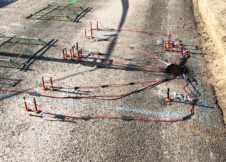 Photo of an array of sensors on a paved surface.