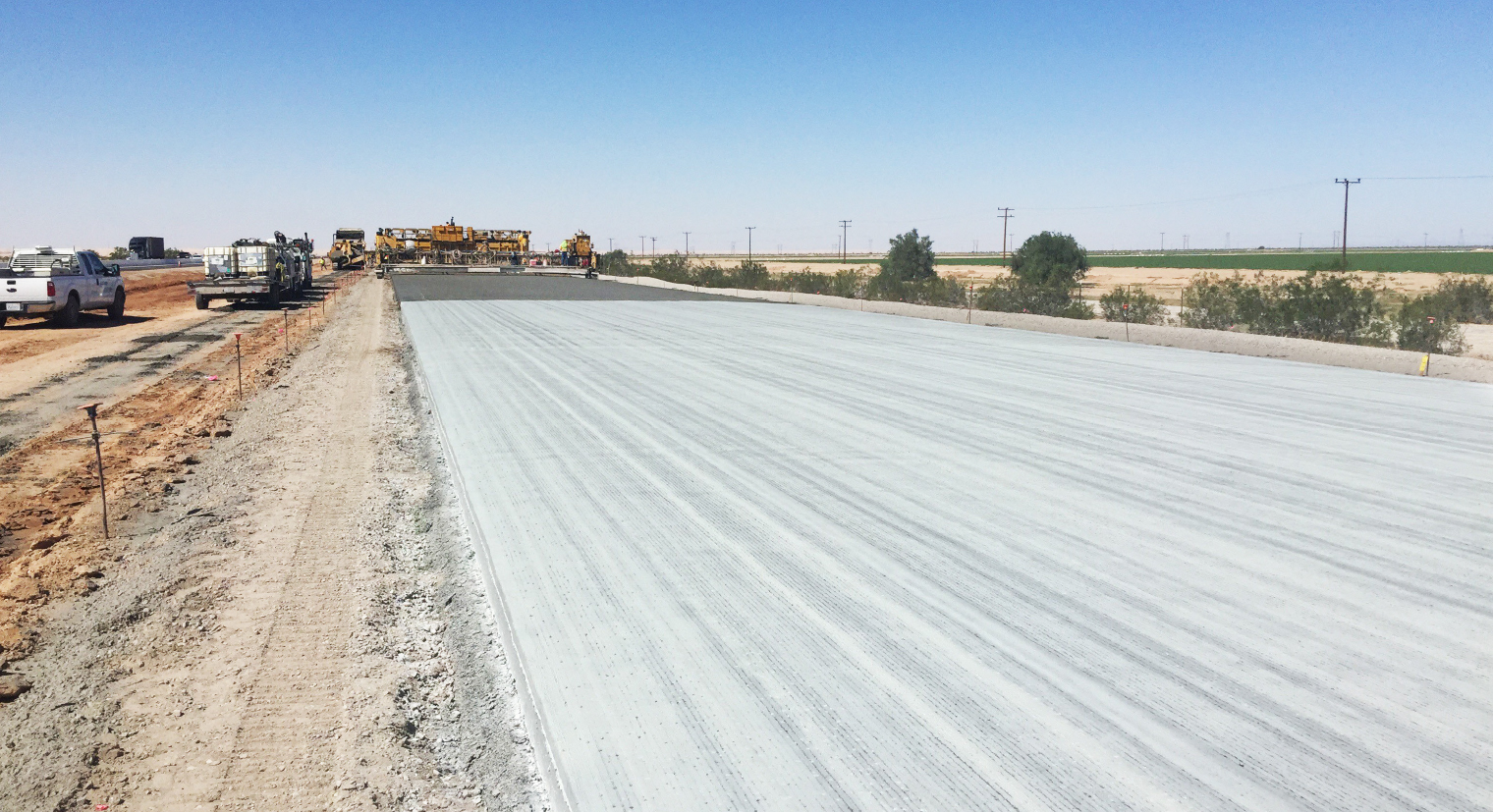 Photo of a partially paved road in rural setting where tests are conducted to evaluate pavement durability.