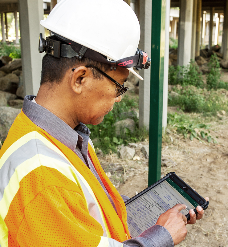 Photo of a Caltrans engineer using a tablet device