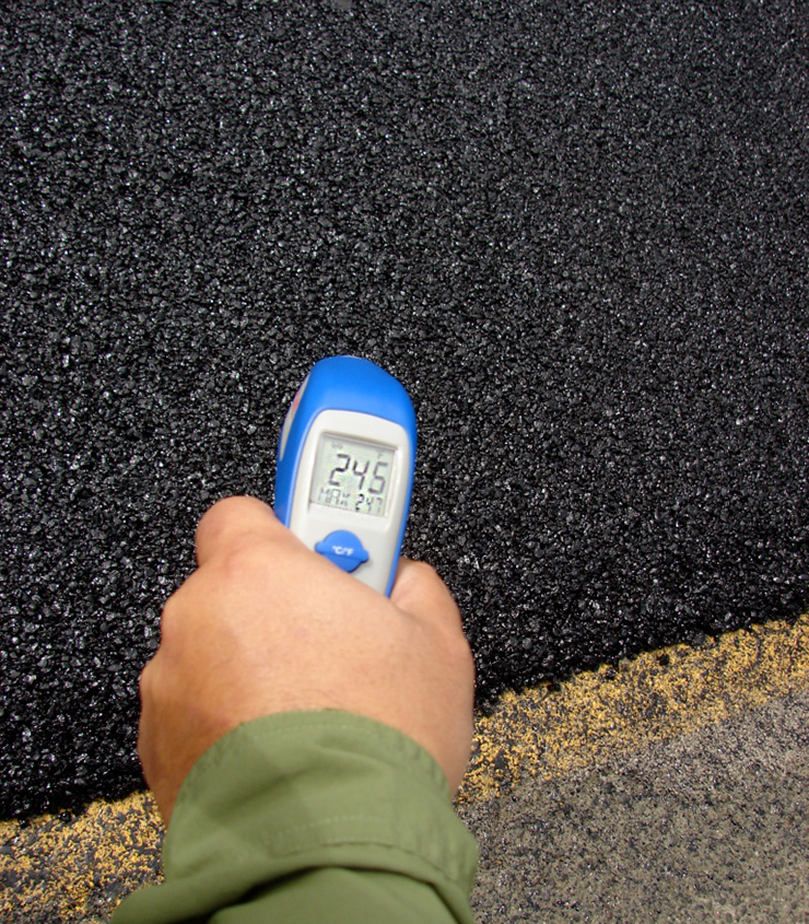 Photo showing and electronic device that takes readings of pavement.
