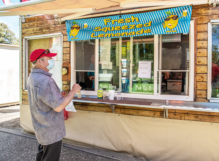 Photo of customer soliciting a food truck at a rest stop.