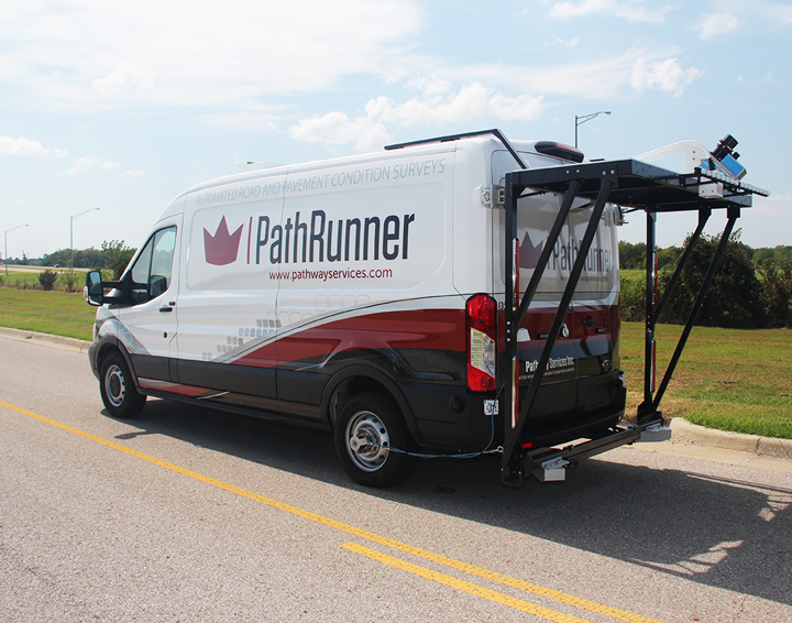 Photo of the Path Runner van driving down a rural road, analyzing pavement conditions.