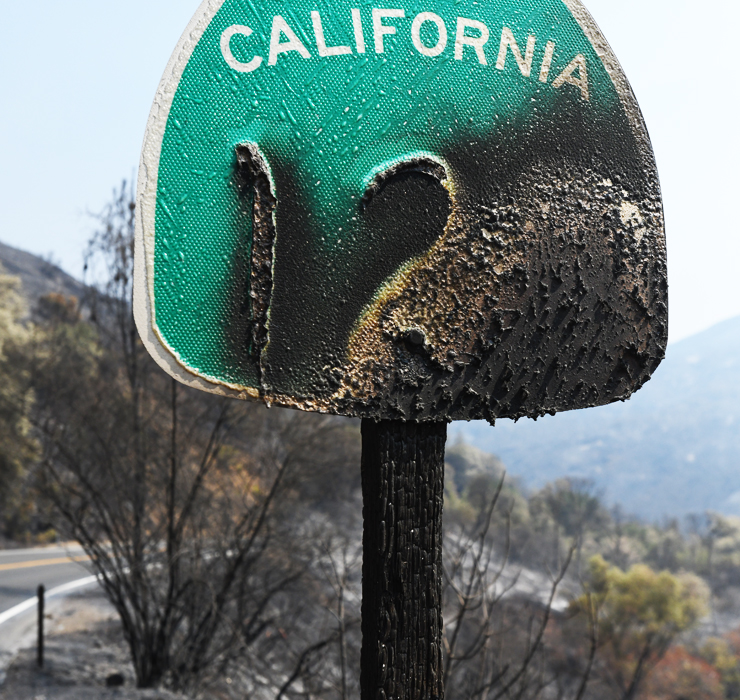 Photo of a burned highway marker on Highway 128 during the Napa fire.