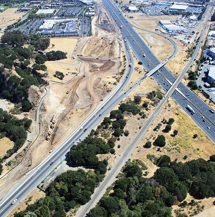 Aerial view of a project site along an expressway.