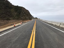 After - California Highway 1 at Rat Creek near Big Sur: 86 days later, on April 22, 2021: road-level view of a newly restriped roadway awaits the return of motorists nearly two months sooner than anticipated.