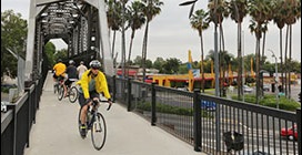 Bicyclists cross a bridge together in Caltrans District 7, which encompasses Los Angeles and Venture Counties.