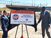 Photo of Caltrans Director Tony Tavares and California Transportation Secretary Toks Omishakin unveiling a project sign with the new Rebuilding California logo on it.