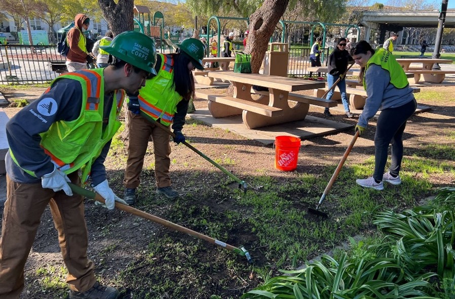 Members of the Conservation Corps and City of San Jose volunteers work  together at a Clean California Community Day in San Jose on March 25.