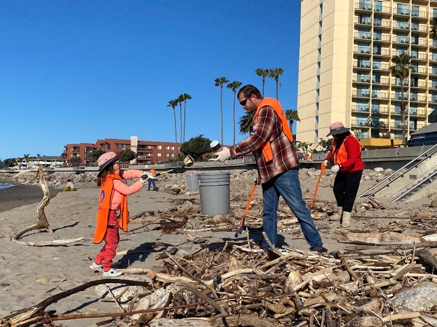 Volunteers pick up trash along the beach at a Clean California  Community Days event in the City of Ventura on March 25.